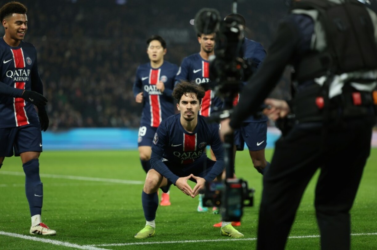 Vitinha (C) celebrates after scoring Paris Saint-Germain's second goal in their 3-1 win over Lyon