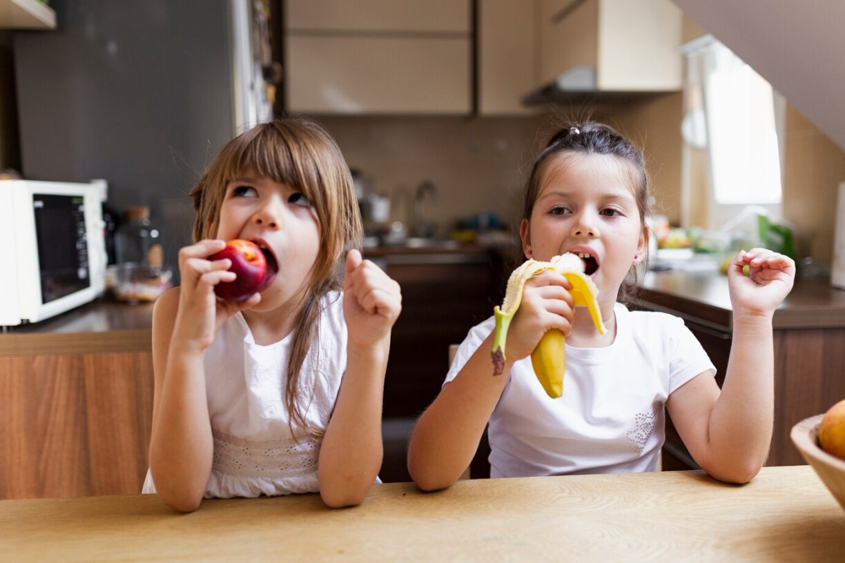 Kids eating healthy snacks.