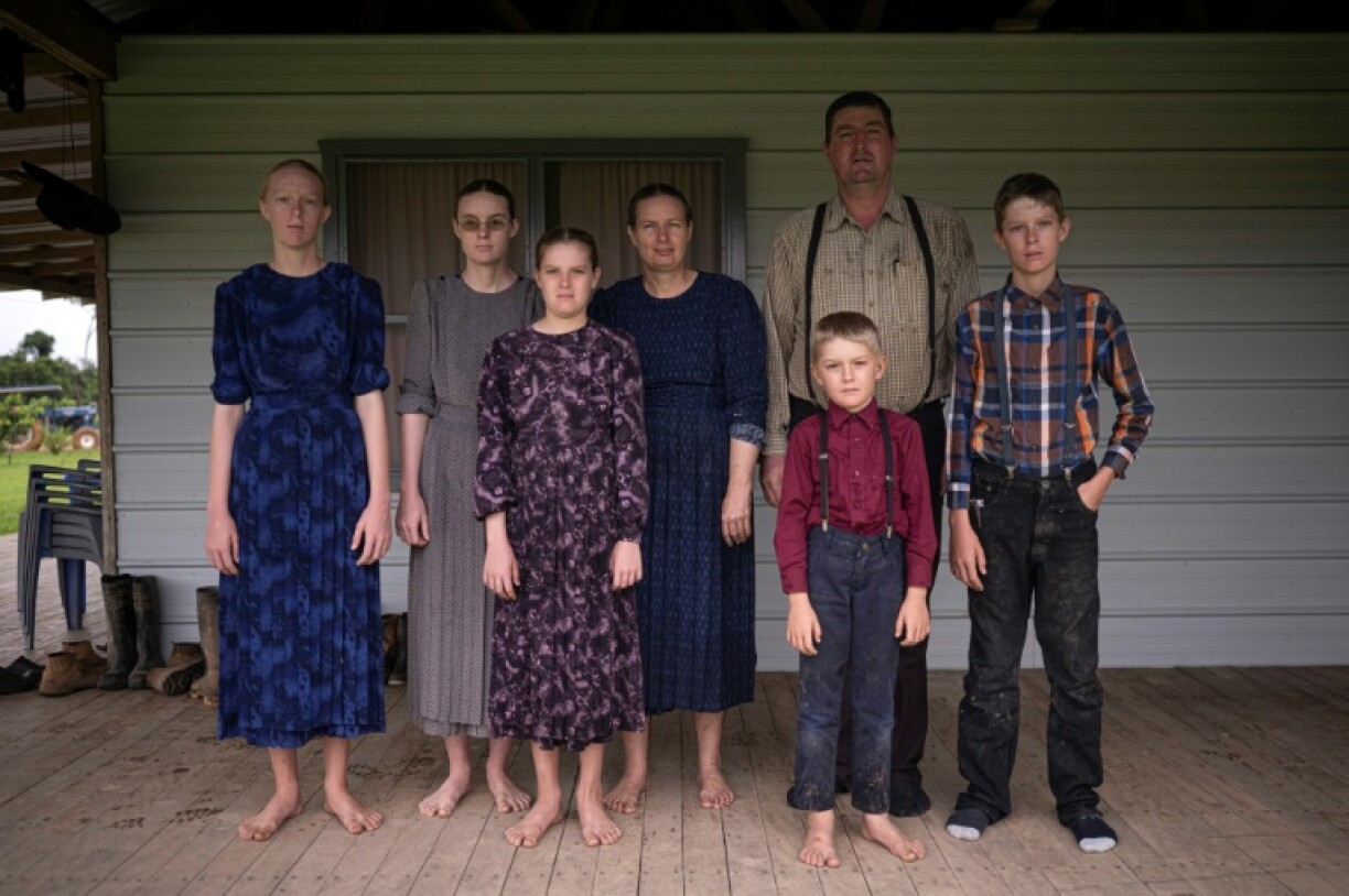 David Klassen, one of the founders of the Mennonite community at Masisea in the Peruvian Amazon, poses for a picture with his family