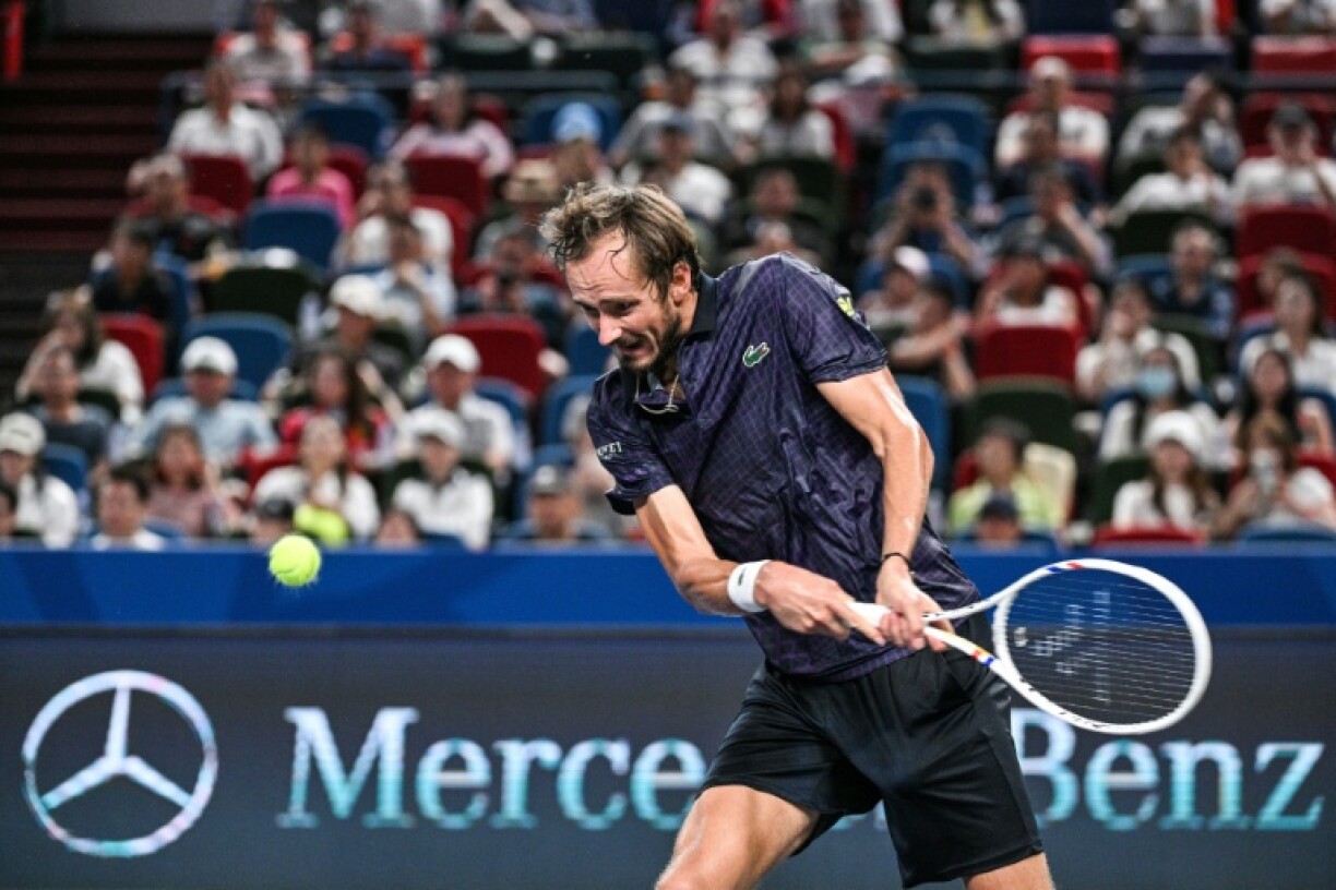 Russia's Daniil Medvedev hits a return to Australia's Alex de Minaur