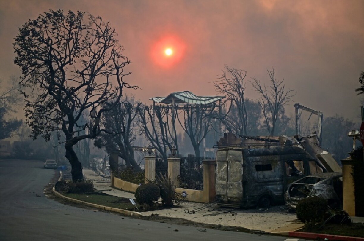 Structures and vehicles charred by the Palisades Fire are seen in Pacific Palisades, California on January 8, 2025