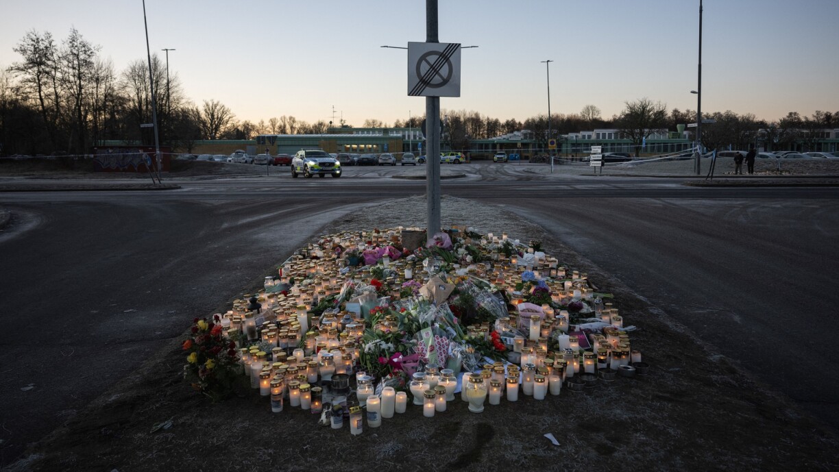 A makeshift vigil is pictured near the adult education center Campus Risbergska school in Orebro, Sweden, on 6 February 2025, two days after a shooting there left eleven people dead.