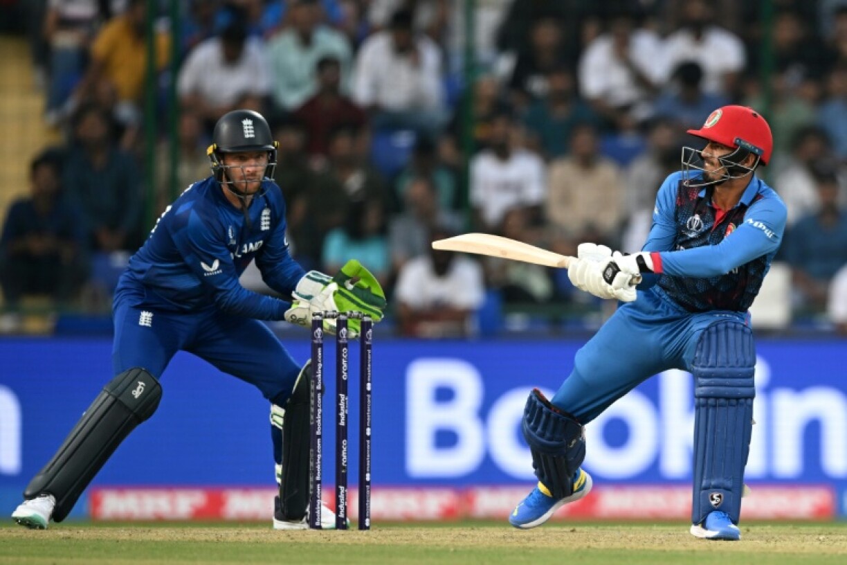 England white-ball captain Jos Buttler (L) played against Afghanistan during a 2023 ODI World Cup match in Delhi