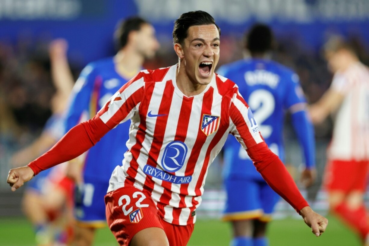 Atletico Madrid forward Giacomo Raspadori celebrates Getafe defender Domingos Duarte's own-goal which decided the game