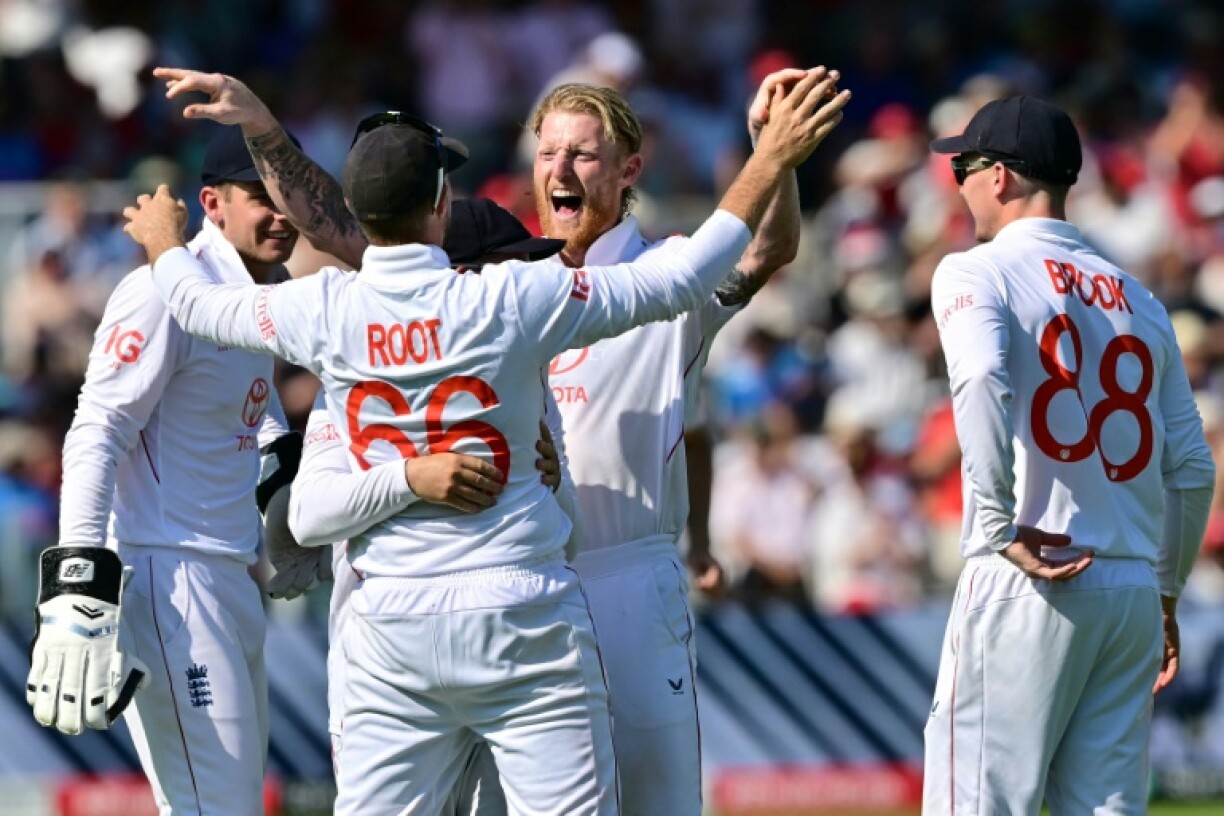 England captain Ben Stokes (C) celebrates with team-mates after dismissing India's Karun Nair in the third Test at Lord's