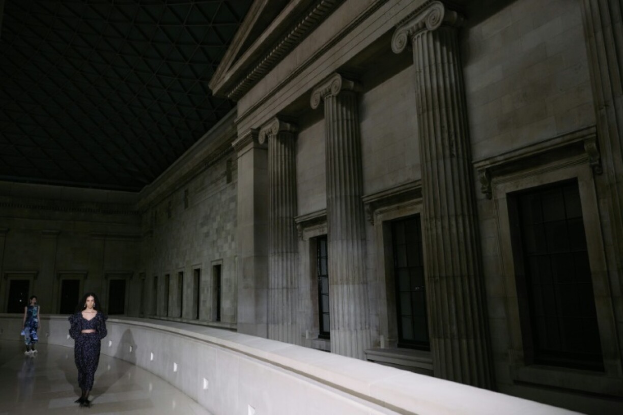 A model at London Fashion Week presents a creation from brand Erdem