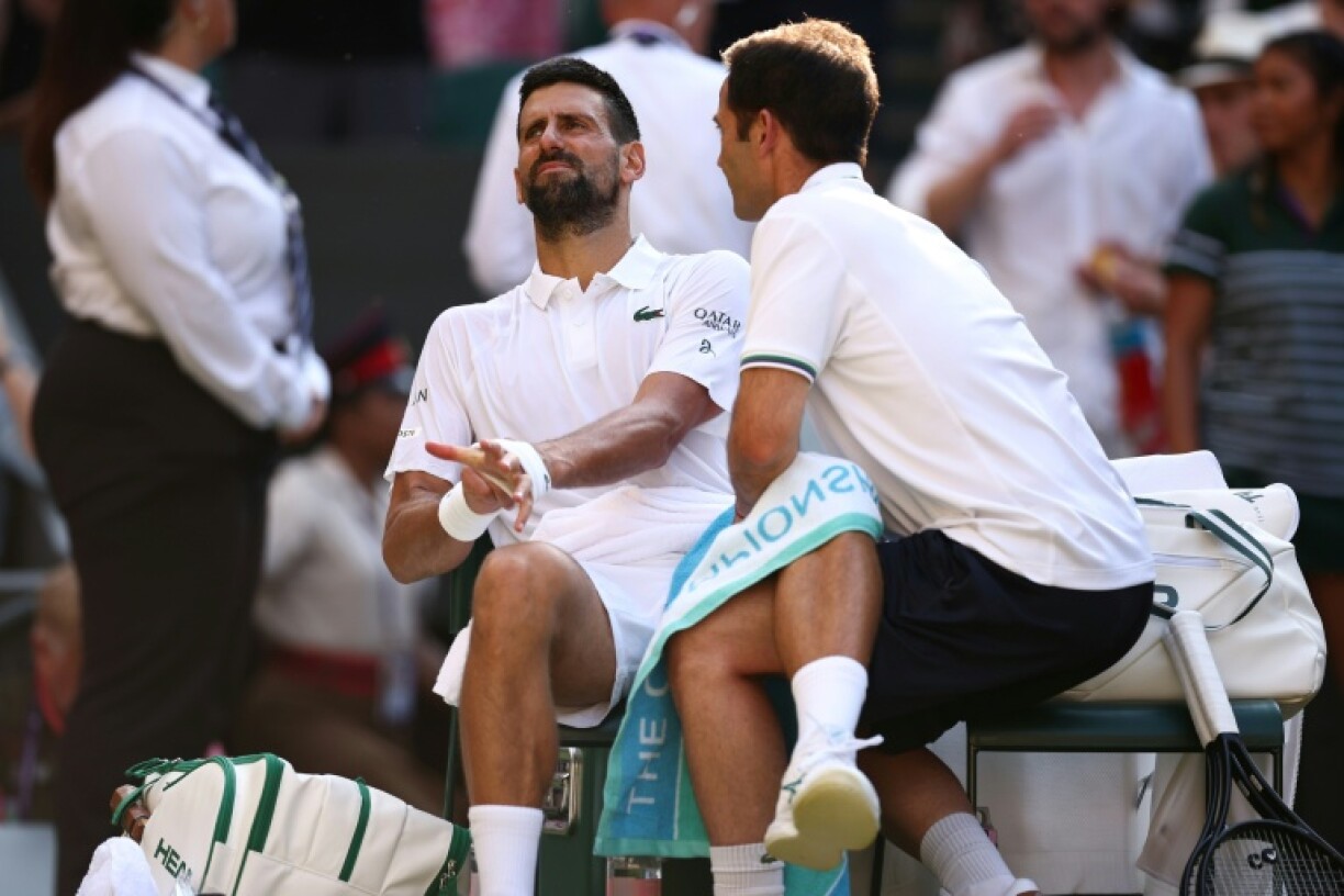 Novak Djokovic receives treatment on his leg in his Wimbledon semi-final against Jannik Sinner