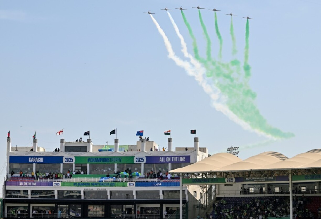 Pakistan Air Force jets fly over the National Stadium in Karachi at the opening ceremony of the ICC Champions Trophy tournament