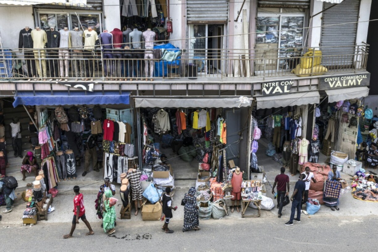 Shops and street vendors sell wares in downtown Dakar in September 2026