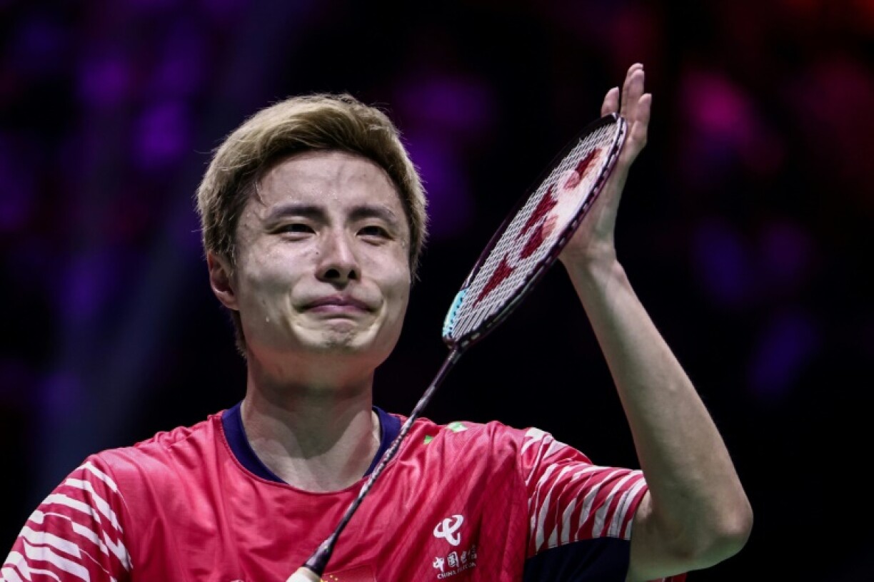 Shi let his emotions show after defeating Thailand's Kunlavut Vitidsarn to win his first worlds title