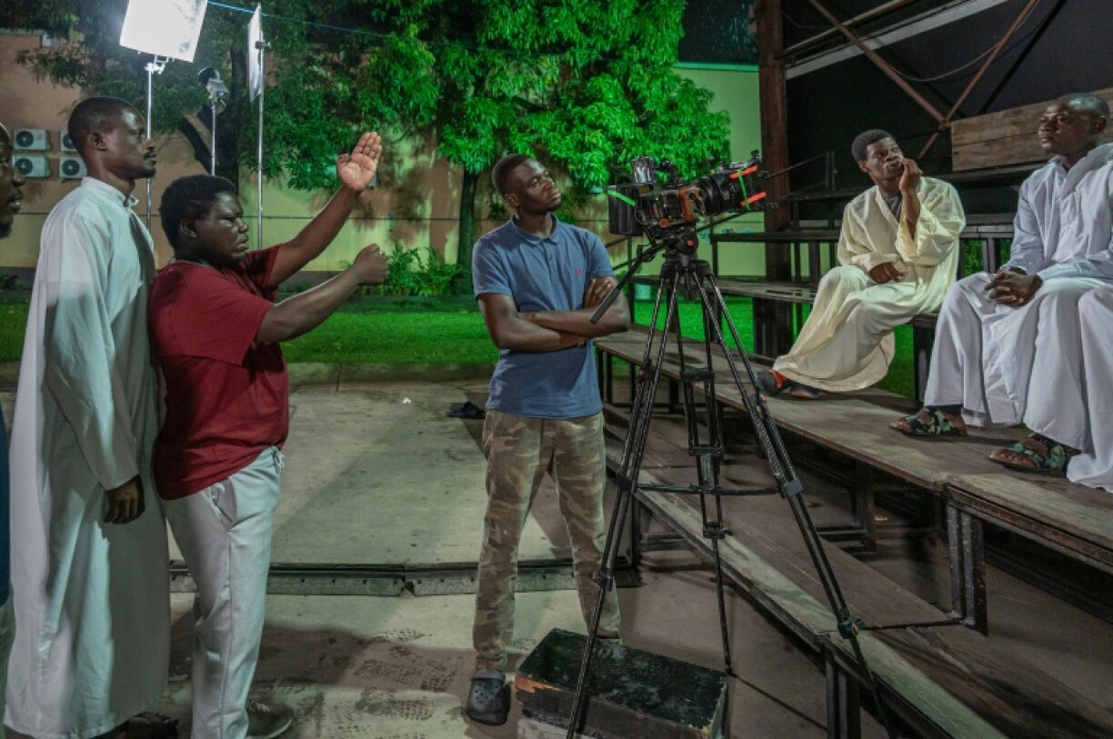 Democratic Republic of Congo film director Dieudo Hamadi (2nd L) makes films dealing with the country's conflicts and corruption