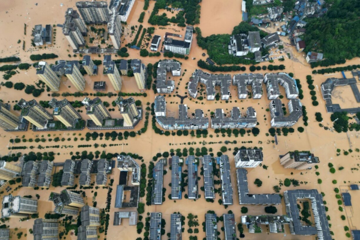 An aerial photo shows flooded buildings in Rongjiang, in China's southwest Guizhou province on June 24, 2025
