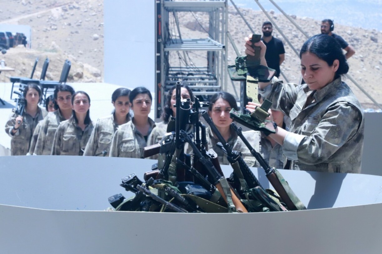 In a ceremony Friday in Iraq members of the Kurdish rebel group PKK destroyed their weapons