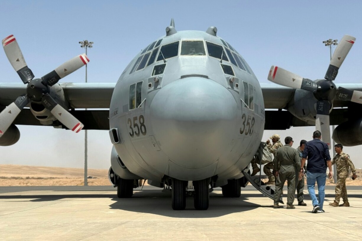 A Royal Jordanian Air Force C-130 Hercules military transport prepares to take off from King Abdullah II airbase with a consignment of aid to airdrop over Gaza.