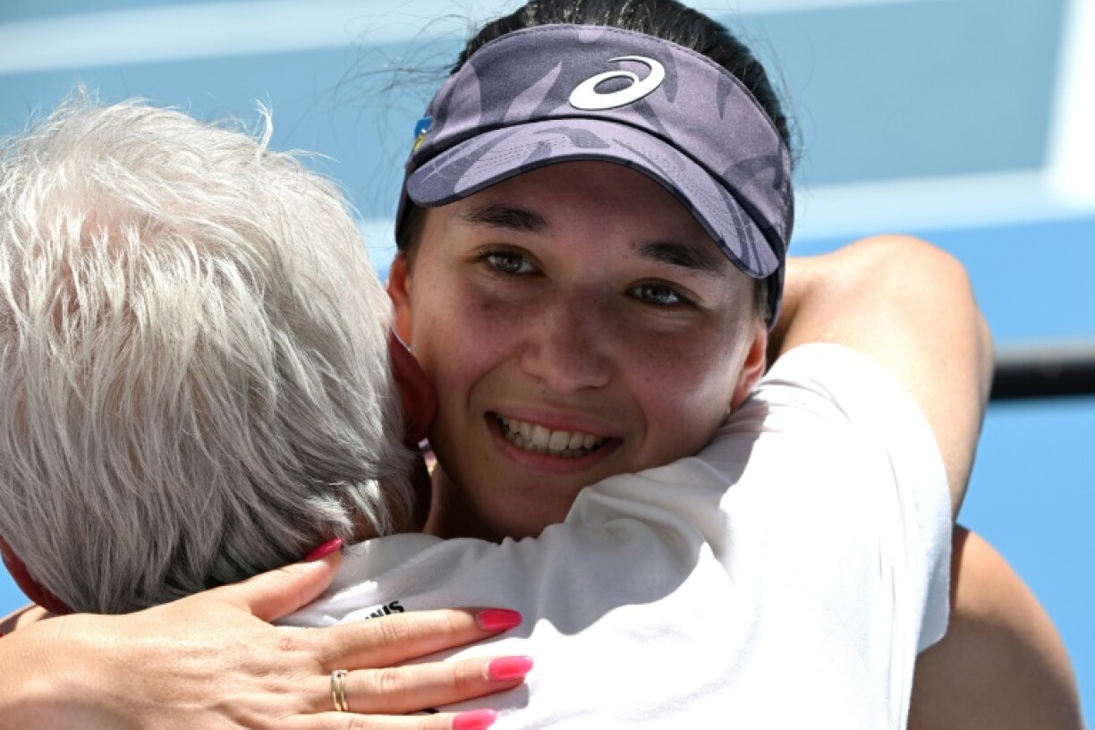 Germany's Eva Lys embraces her family