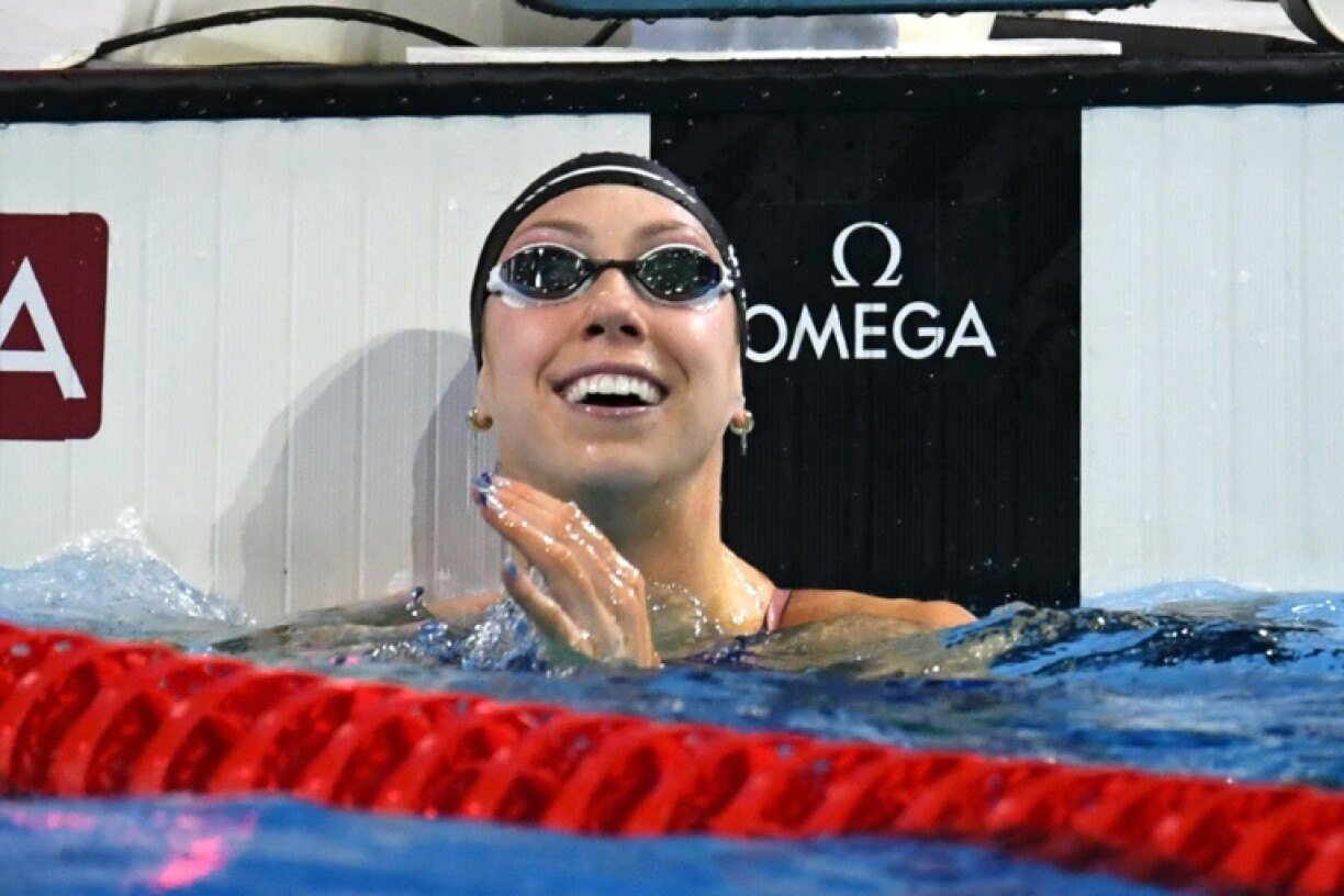 Gretchen Walsh celebrates after winning the women's 50 meters freestyle in a world-record time at the short-course world championships in Budapest