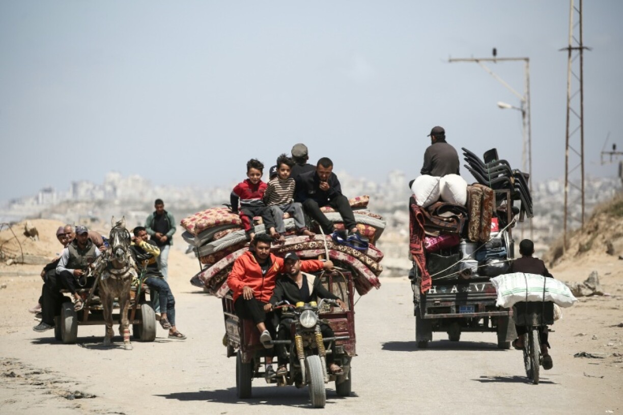 Palestinians heading south along a coastal road from Gaza City, as Israel expands operations in the north
