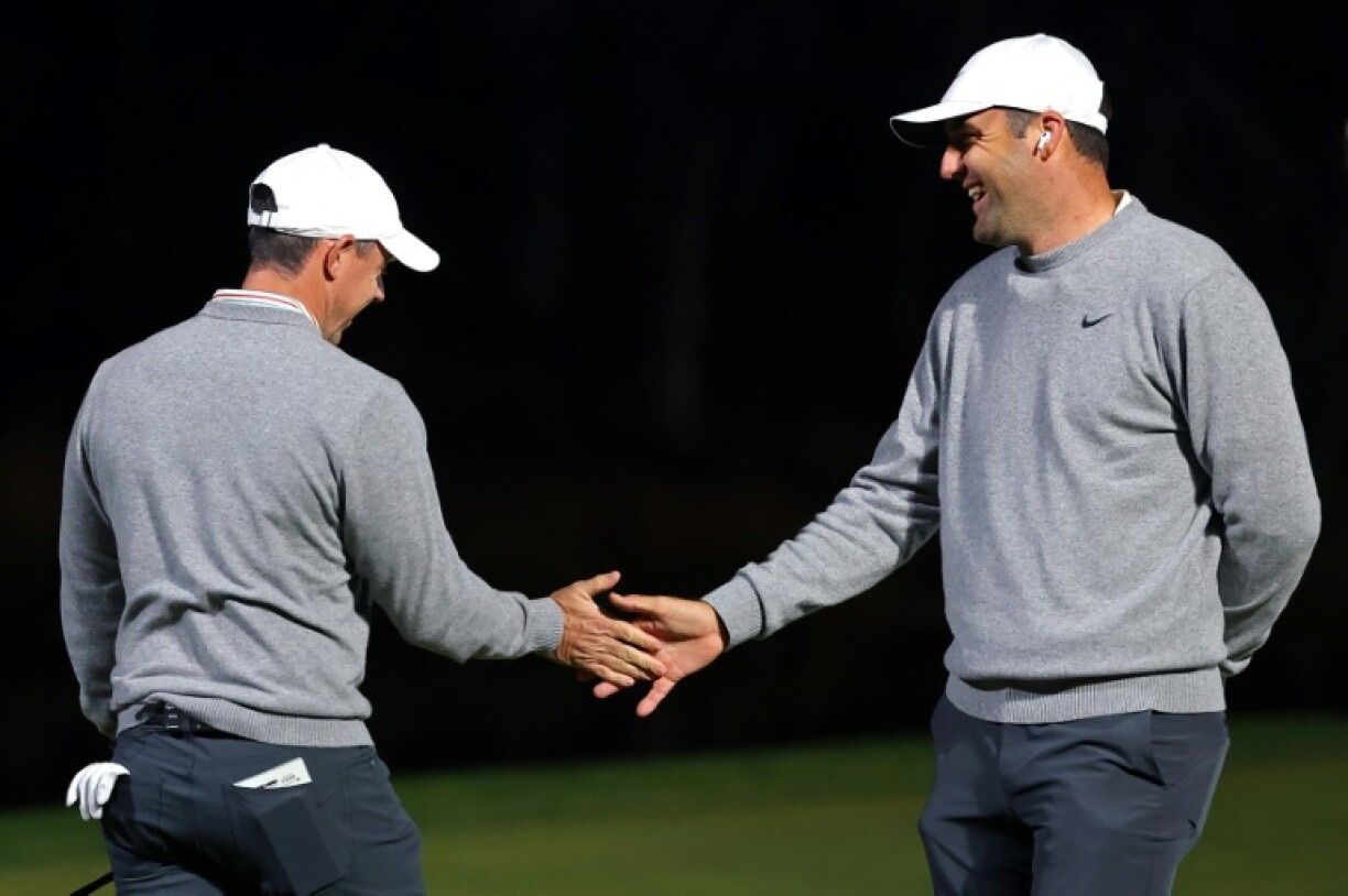Rory McIlroy, left, and Scottie Scheffler of the PGA Tour celebrate in the Showdown, in which they defeated LIV Golf's Bryson DeChambeau and Brooks Koepka