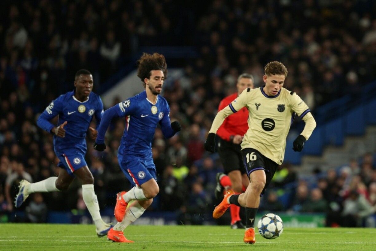 Barcelona's Spanish midfielder Fermin Lopez (R) during the UEFA Champions League match against Chelsea in London