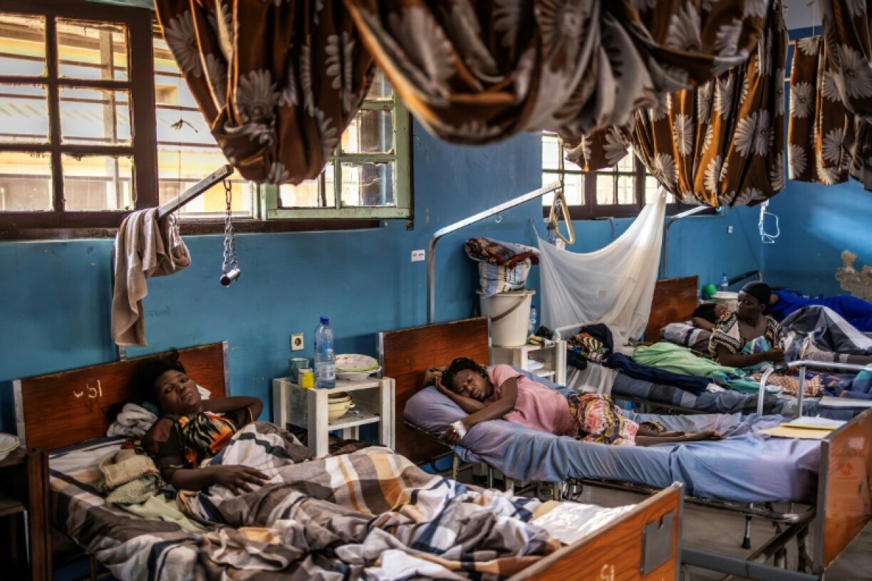 Wounded women lay in Bukavu following clashes during the ongoing M23 advance