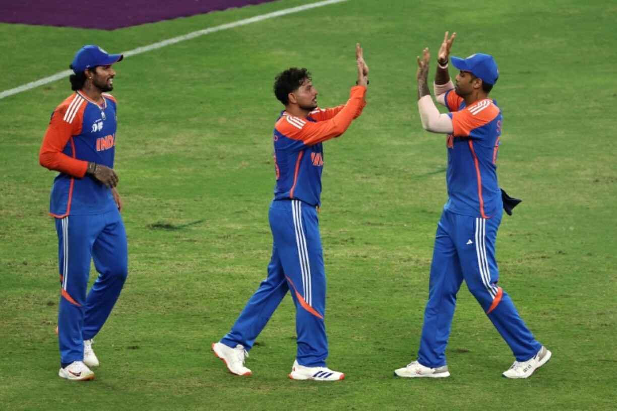 India's Kuldeep Yadav (C) celebrates taking the wicket of Pakistan's Faheem Ashraf in the Asia Cup final