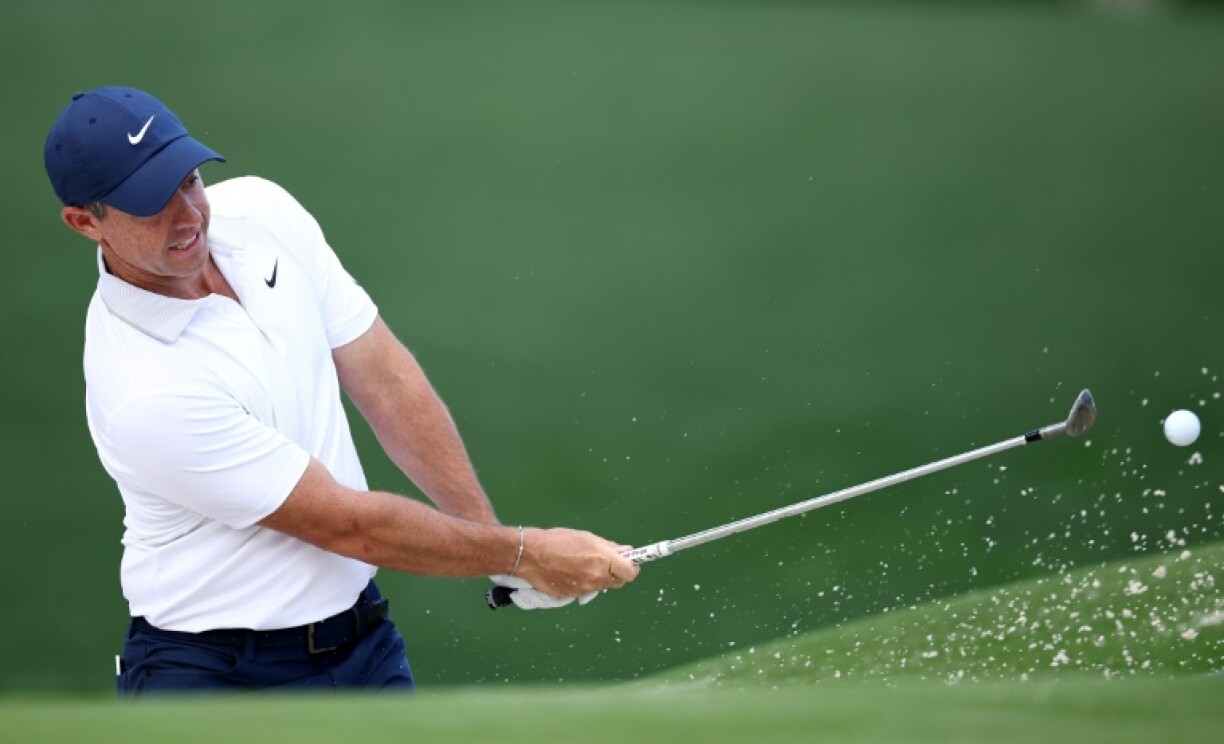 Second-ranked Rory McIlroy of Northern Ireland, the reigning Masters champion, makes a practice chip in preparing for the 107th PGA Championship at Quail Hollow, a course where he has won four times