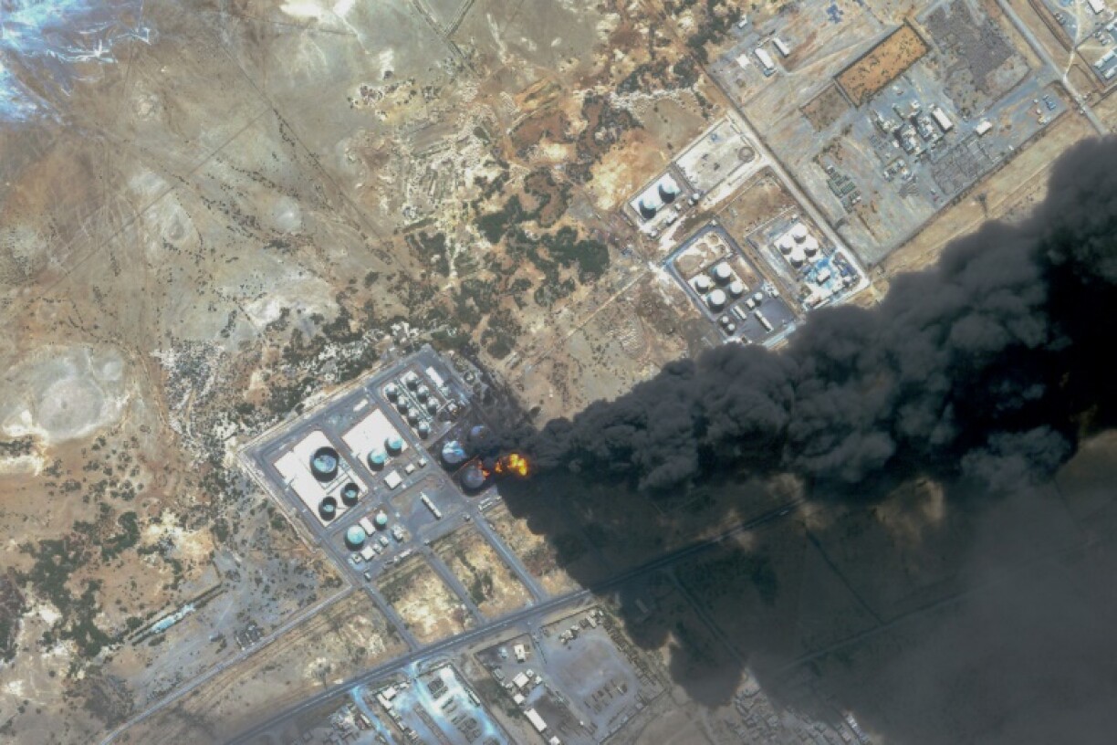 A handout satellite photo from Planet Labs PBC dated May 6 shows smoke billowing from a fuel storage depot in Port Sudan