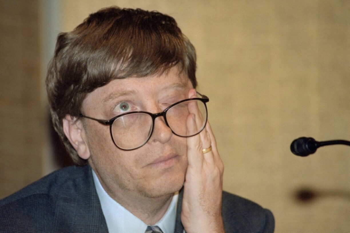 Bill Gates, then Microsoft's CEO, wipes his eye during a June 1996 press conference in Tokyo