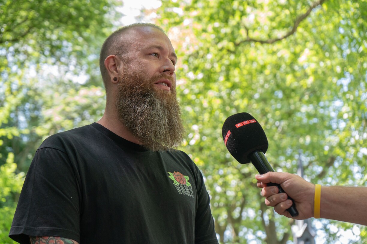 Philippe Bonert speaking to RTL reporters about his work as a psychiatric nurse.