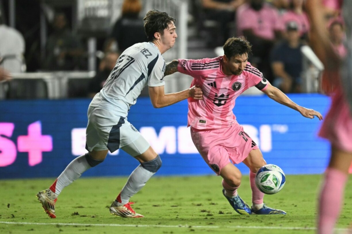 Inter Miami's Lionel Messi is challenged by Chicago's Brian Gutierrez in their Major League Soccer clash