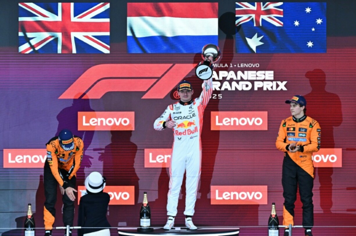 From left, second-placed Lando Norris, winner Max Verstappen and third-placed Oscar Piastri on the podium