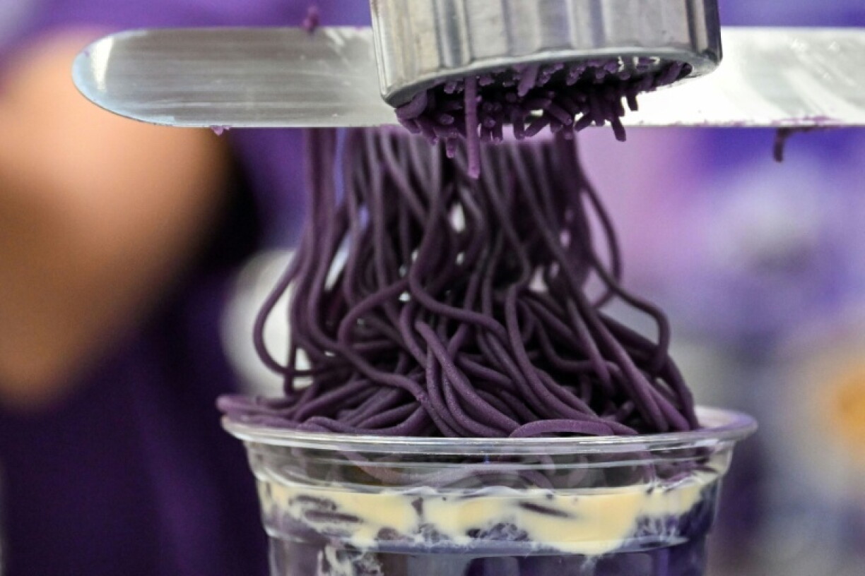 Ube halaya topping over sweet ube rice porridge (champorado) is a popular treat in the Philippines
