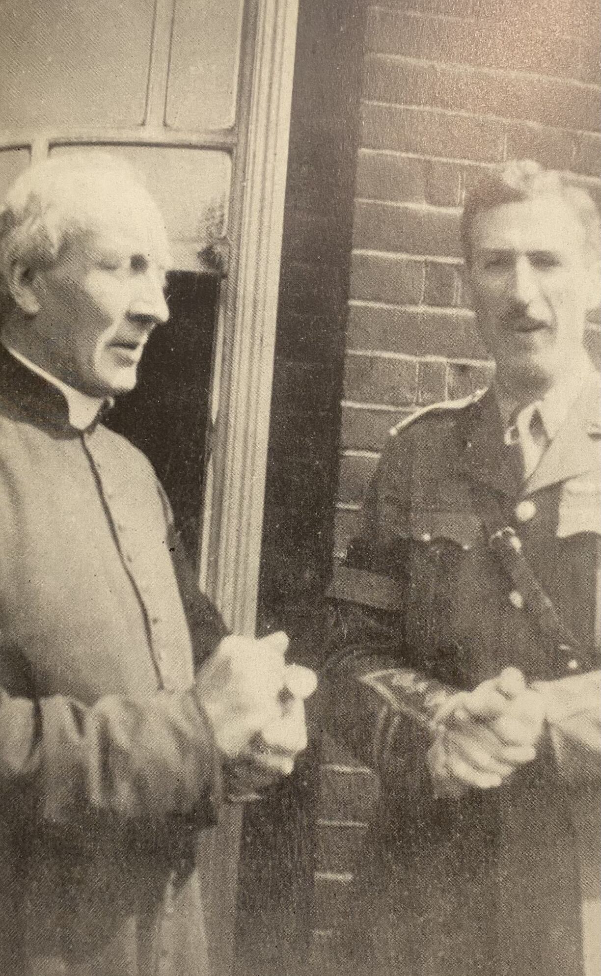 Father Cambron (left) with Captain George Bruce (right).