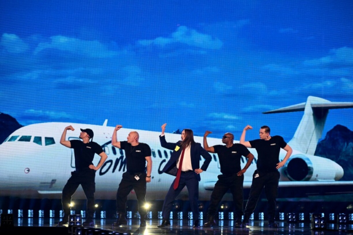 Estonian singer Tommy Cash (C) made it through to the Eurovision final with his song 'Espresso Macchiato'