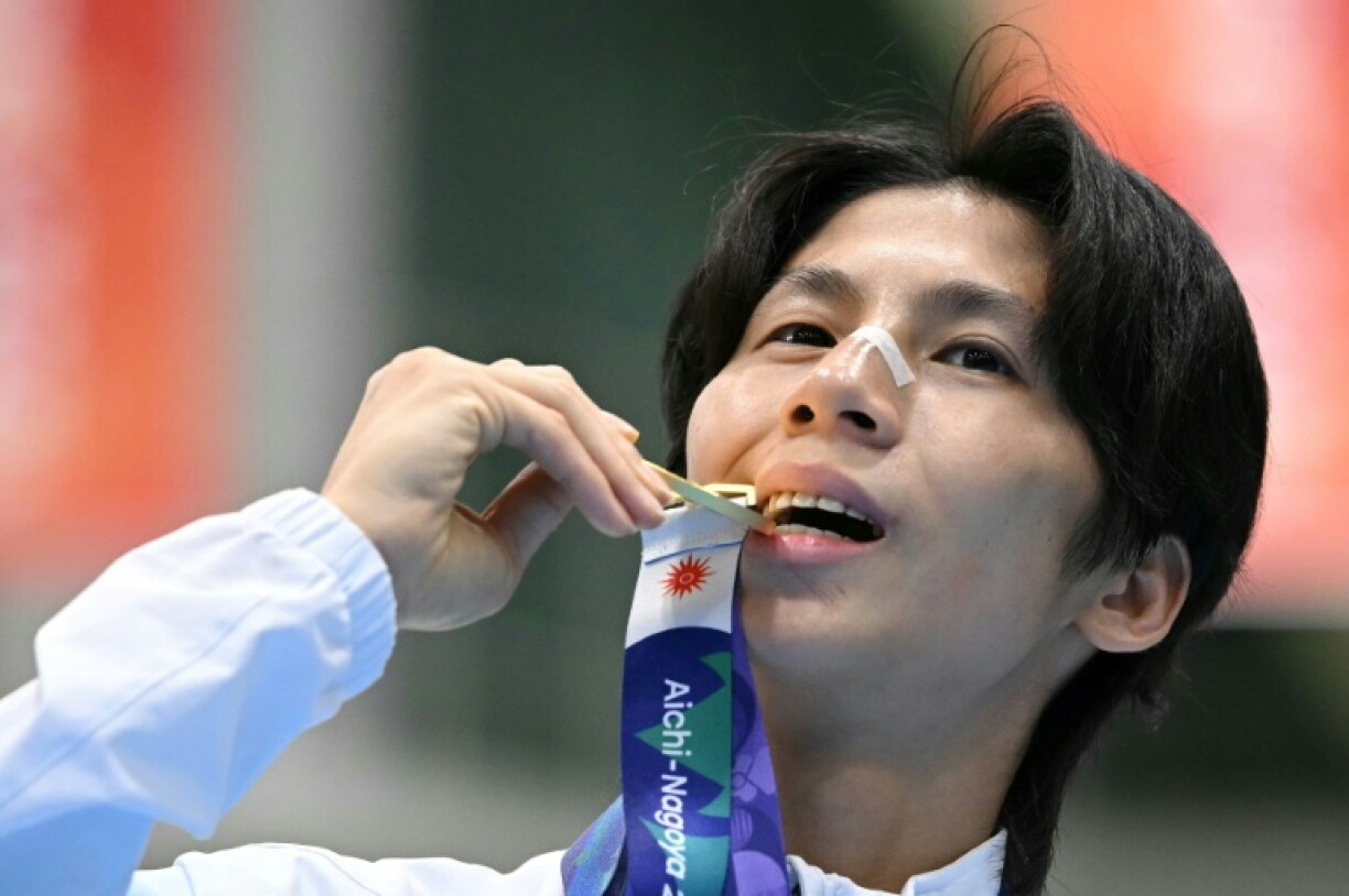 Gold medallist Lin Yu-ting celebrates on the podium