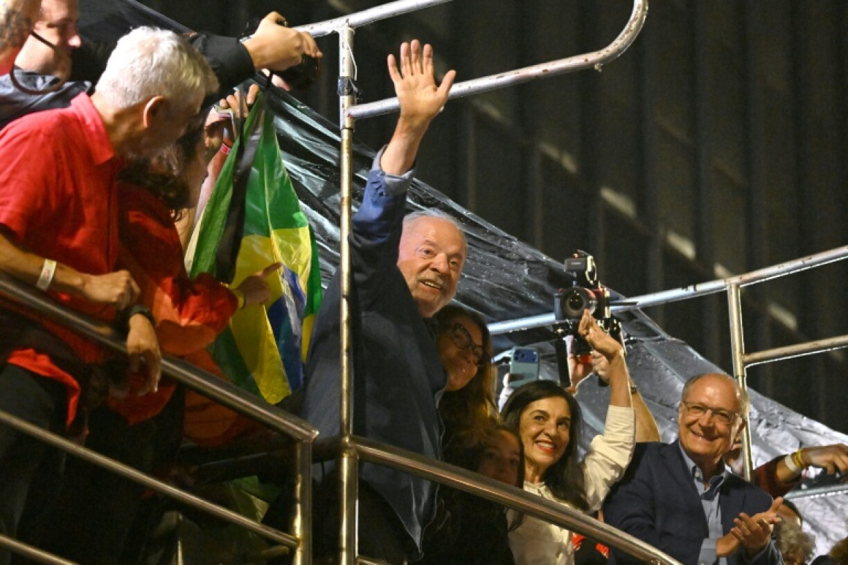 Brazil's President and presidential candidate Luiz Inacio Lula da Silva gestures to celebrating supporters