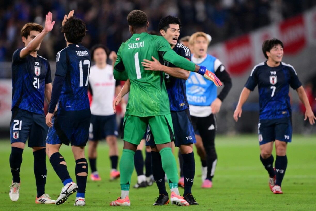 Japan celebrate their first win against Brazil after coming from 2-0 down at half-time to win 3-2 in a thriller