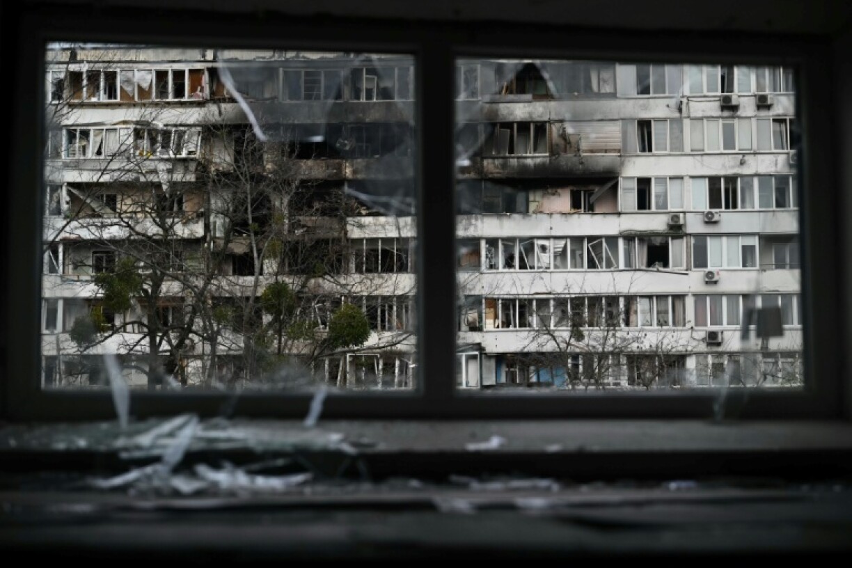Damaged residential buildings can be seen in Kyiv after a fresh bombardment by Russia, even as negotiators work on tweaking a US-supported deal to end the war in Ukraine