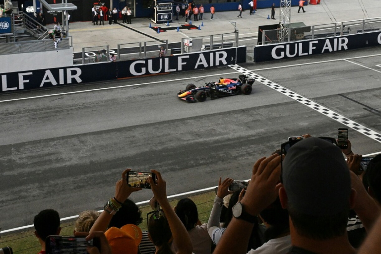 Red Bull Racing's Dutch driver Max Verstappen crosses the finish line to win the Formula One Bahrain Grand Prix in Sepang on October 4, 2026.