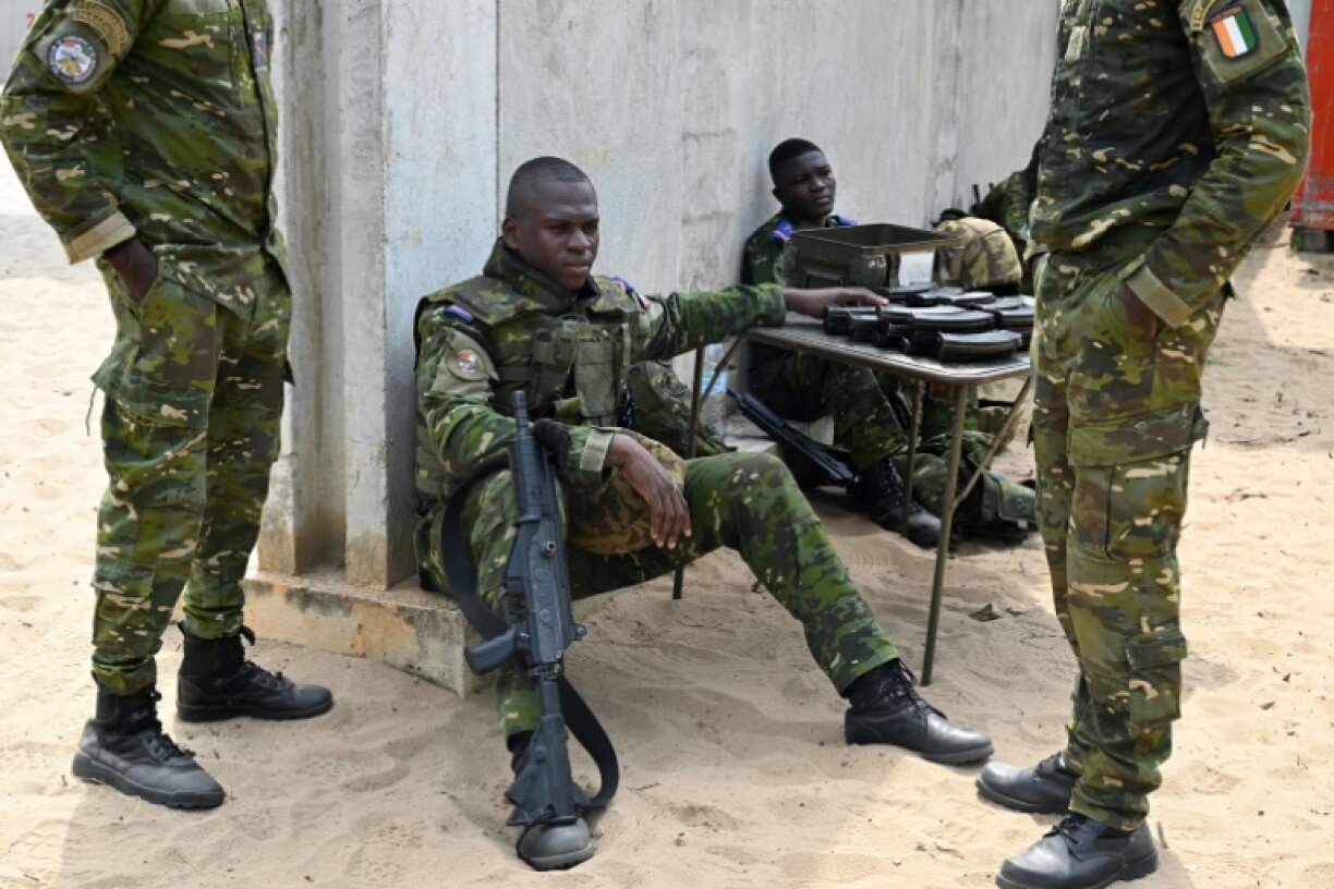 Ivorian soldiers resting at a shooting range in Port-Bouet
