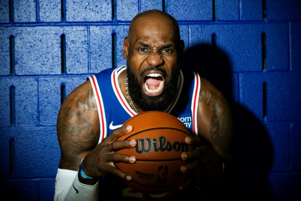 LeBron James poses for a portrait with his new club, the Philadelphia 76ers