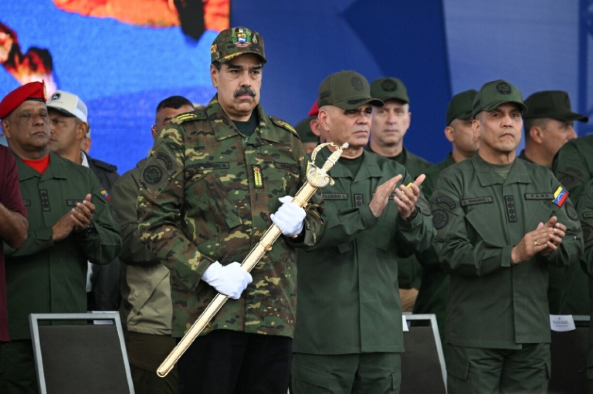 Venezuela's President Nicolas Maduro held independence hero Simon Bolivar's 'Sword of Peru' during a military ceremony on the same day US Defense Secretary Pete Hegseth was to visit the Dominican Republic amid regional tensions