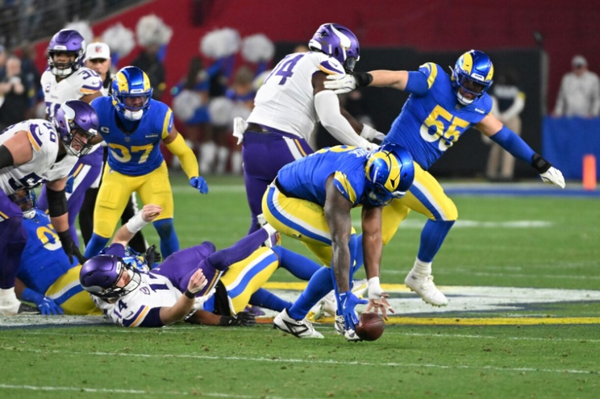 Jared Verse of the Los Angeles Rams returns a fumble for a touchdown in the Rams' NFL playoff victory over the Minnesota Vikings in Glendale, Arizona