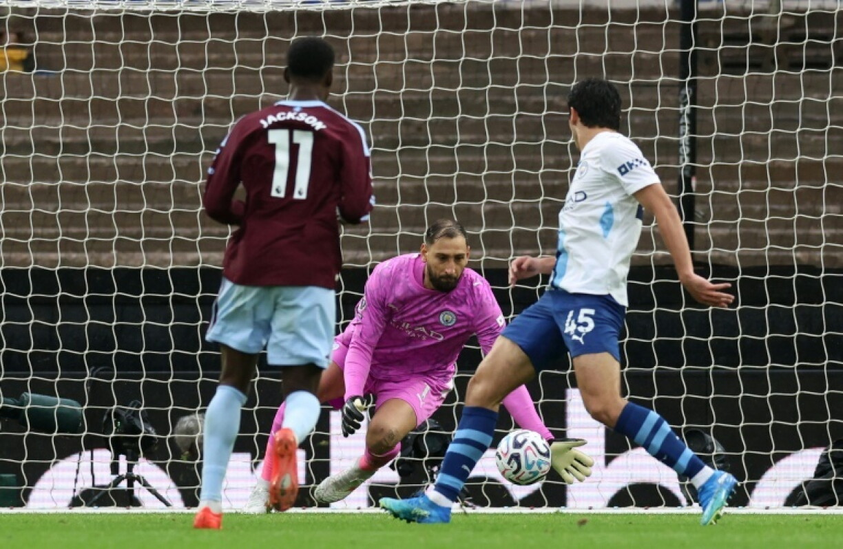 Nicolas Jackson (L) scores his second goal for Aston Villa against Manchester City at Villa Park