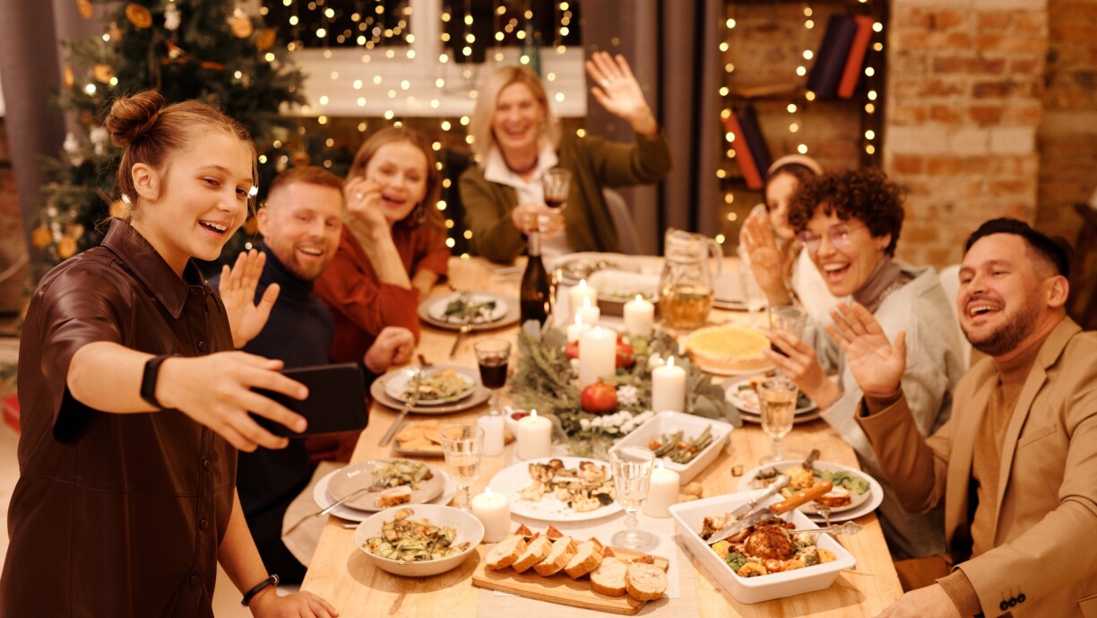 Family Celebrating Christmas Dinner While Taking Selfie