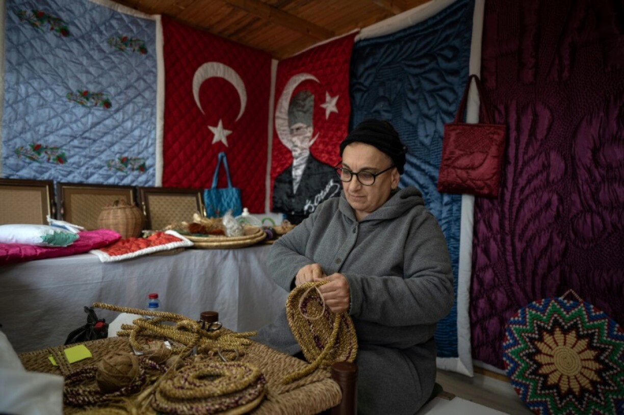 Traditional quilt artist Nahya Guzelyurt works at the Antakya Art and Culture Market in Antakya