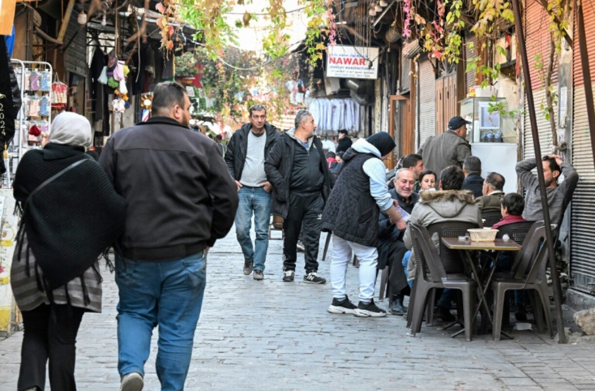 Syrians chat at a cafe in the historic Old City of Damascus.