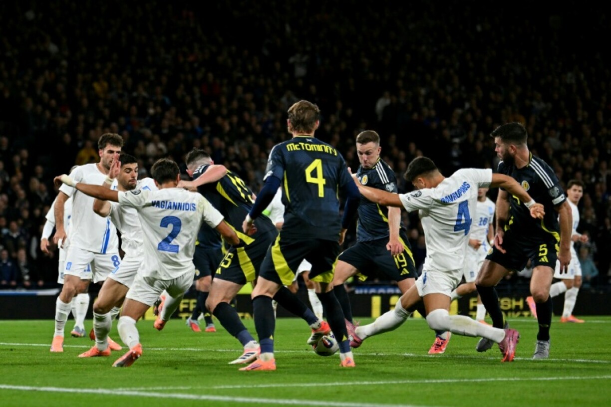 Lewis Ferguson (3R) opened his account for Scotland, blasting in after the Greeks failed to clear an Andy Robertson free-kick