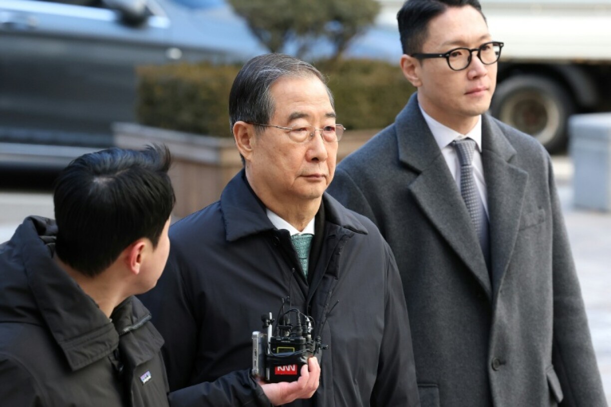 L'ancien Premier ministre sud-coréen Han Duck-soo arrive au tribunal central de Séoul, le 21 janvier 2026