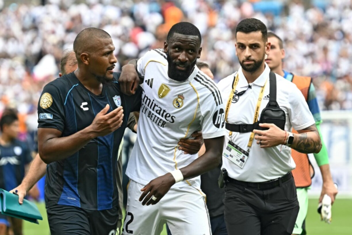 Real Madrid's Antonio Rudiger (centre) leaves the field after accusing an opponent of making a racist remarks at the end of Sunday's Club World Cup match against Pachuca